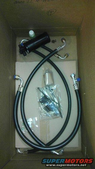 Black AC receiver drier and hoses in a cardboard box