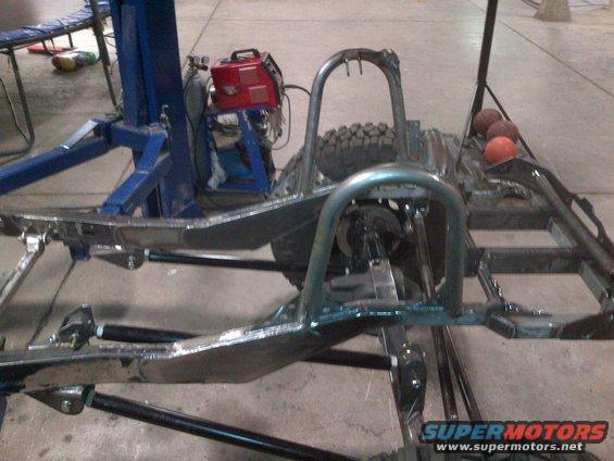 Jeep CJ frame with roll cage and spare tire