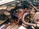 1982 Ford Bronco - Close-up view of an engine bay, showing various components and wiring.