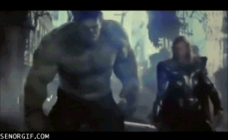 Hulk and Thor walking forward in a dimly lit environment