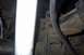 1994 Ford Bronco - Detail shot of a vehicle's suspension components, focusing on the leaf spring and shock absorber.