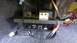 1996 Lincoln Town Car - Close-up of a car amplifier and wiring installed in the trunk, with visible RCA connectors and power cables.