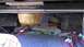 1996 Lincoln Town Car - Exposed wiring and a subwoofer enclosure are visible in the trunk of a car.