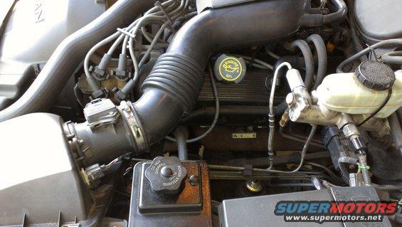 Engine bay with oil cap and brake fluid reservoir