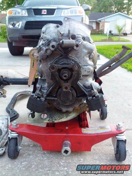 Transmission on red dolly with Saturn Vue in background