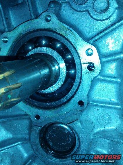 Close-up of a transmission bearing with visible ball bearings and a metal shaft
