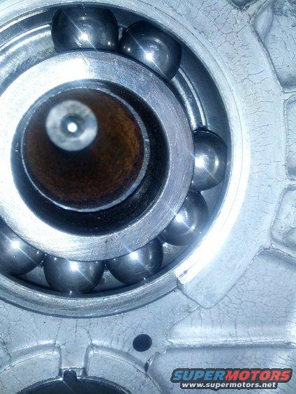 Close-up of a ball bearing inside a metal housing