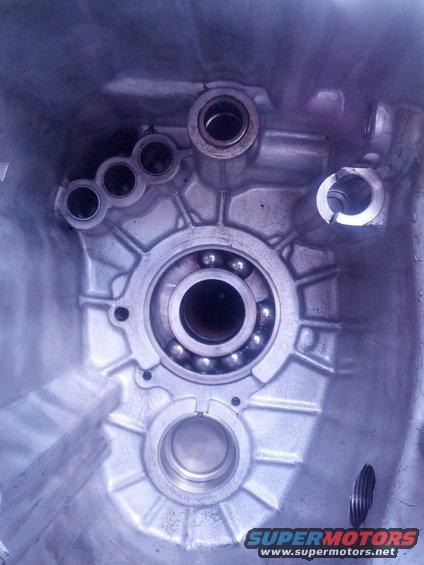 Interior view of a transmission housing showing ball bearings and mounting points