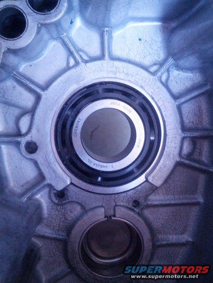 Close-up of a transmission housing showing a bearing with 'GERMANY' and part numbers visible
