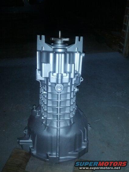 Silver painted transmission housing with a shaft protruding from the top