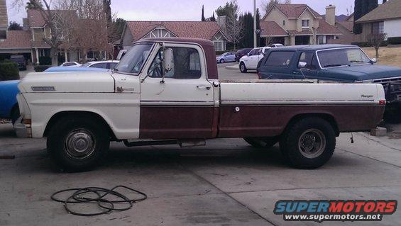 White and maroon 1970 Ford F-250 pickup truck, side view