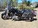 1998 Honda Shadow VT750C - A black motorcycle with saddlebags and a windshield is parked outdoors. The phrase 'In God We Trust' is visible on the side of the motorcyc…