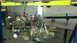 1996 Ford Bronco - An engine and transmission assembly is being lifted by an engine hoist in a workshop.