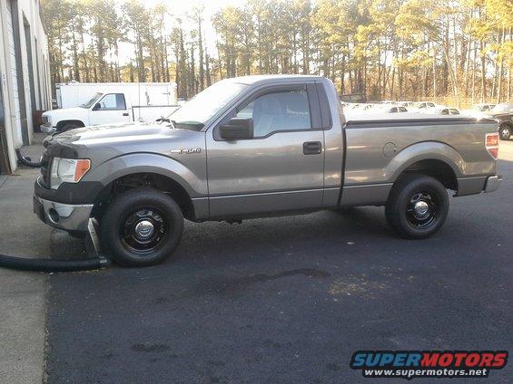 Gray 2013 Ford F-150 pickup truck, side view, parked outdoors