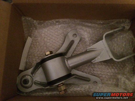 Metal engine mount part in bubble wrap inside a cardboard box