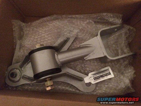Engine mount part in box with lubricant packet. Supermotors.net logo visible