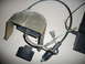 1993 Mazda MX-3 - An automotive electrical component with a metal housing and various wires is shown on a flat surface.