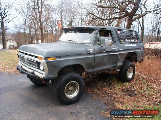 Dark gray 1979 Ford Bronco with lifted suspension and aftermarket wheels