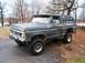 1979 Ford Bronco - This lifted 1979 Ford Bronco is shown in a three-quarter front view, parked outdoors on a slightly uneven surface.