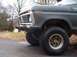 1979 Ford Bronco - This Ford Bronco features a distinctive grille and headlight design, along with off-road tires and a custom bumper.