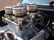 1972 Ford Ranchero - Close-up of a performance engine a triple carburetor setup with chrome air filters.