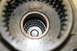 1995 Ford Bronco - Internal view of a vehicle's transfer case, showing gears and a roller bearing assembly.