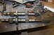1995 Ford Bronco - Two transfer case output shafts are laid out on a workbench, possibly for comparison or repair.