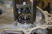 1995 Ford Bronco - A bearing puller tool is used to remove a bearing from a transfer case housing.