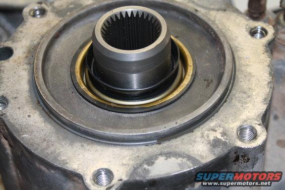 Close-up of a transfer case input shaft seal and housing