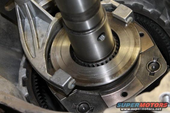Close-up of a metal transfer case component with gears and a shaft