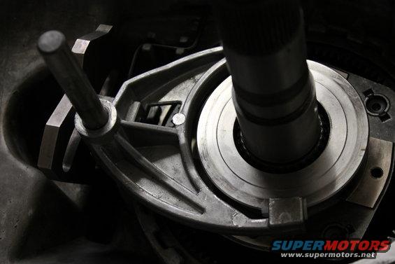 Close-up of a metal transfer case component with a shaft