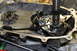 1995 Ford Bronco - Close-up view of the internal components of a vehicle's transfer case, showing gears and shafts.