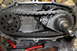1995 Ford Bronco - Close-up view of the internal components of a transfer case, including the chain and gears, with a website logo visible.