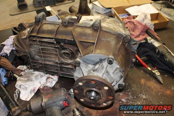 Transfer case assembly on workbench with tools