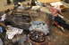 1995 Ford Bronco - A transfer case assembly sits on a workbench, surrounded by tools and shop rags.