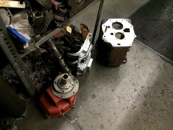 transmission case and shaft components on a workshop floor