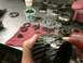 1997 Dodge 3500 - Damaged transmission gears are laid out on a workbench, suggesting a rebuild is underway.