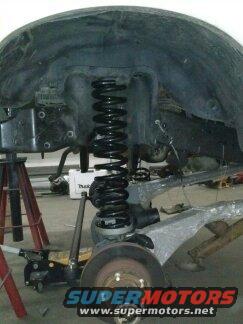 Front suspension and coil spring assembly on jack stands