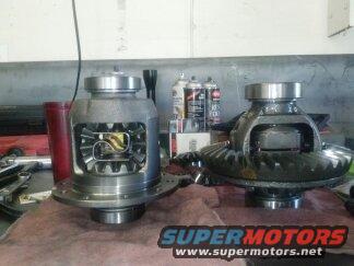 two open differentials sitting on a workbench