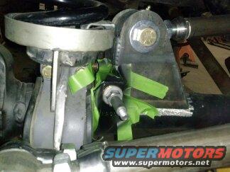 Custom suspension bracket attached to a differential housing with green tape
