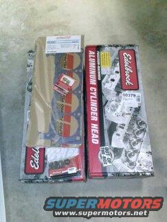 Two boxes of Edelbrock aluminum cylinder heads and gasket set