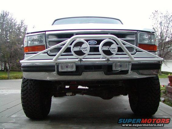 Front view of a 1995 Ford Bronco with a white bull bar and auxiliary lights