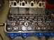 1967 Ford Mustang - Close-up view of an engine block and cylinder head assembly with visible valves and springs.