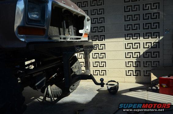 Front of a 1979 Ford Bronco with a hitch receiver and ball mount attached