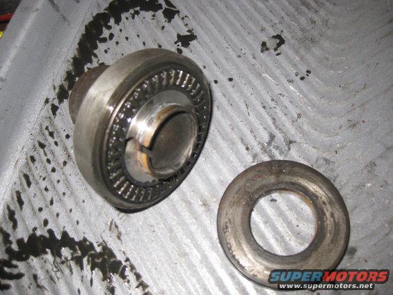 Bearing and washer assembly on a textured surface with oil stains