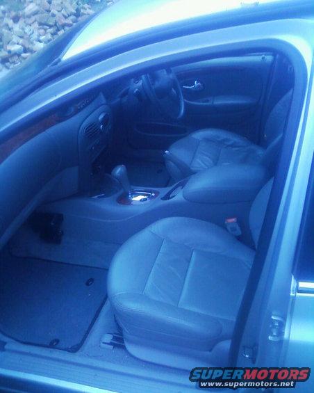 Interior view of a car with leather seats and dashboard