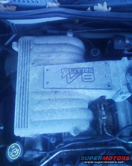 Engine intake manifold with "5.0 LITRE V8" text