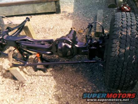 Front axle and suspension parts on jack stands
