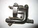 2003 Ford Escort - A black plastic thermostat housing is shown against a white background.