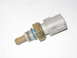 2003 Ford Escort - This is a temperature sensor with a gray electrical connector and a brass threaded fitting.